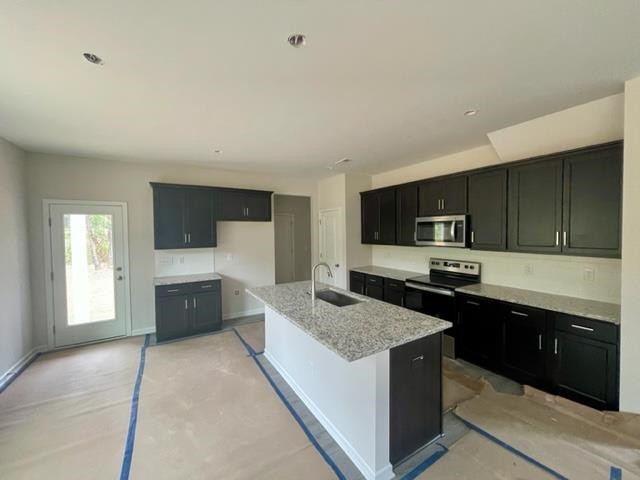 296 Great Pine Trail Middlesex, NC 27557 - Photo 4 of 16 a kitchen with stainless steel appliances granite countertop a sink stove and refrigerator