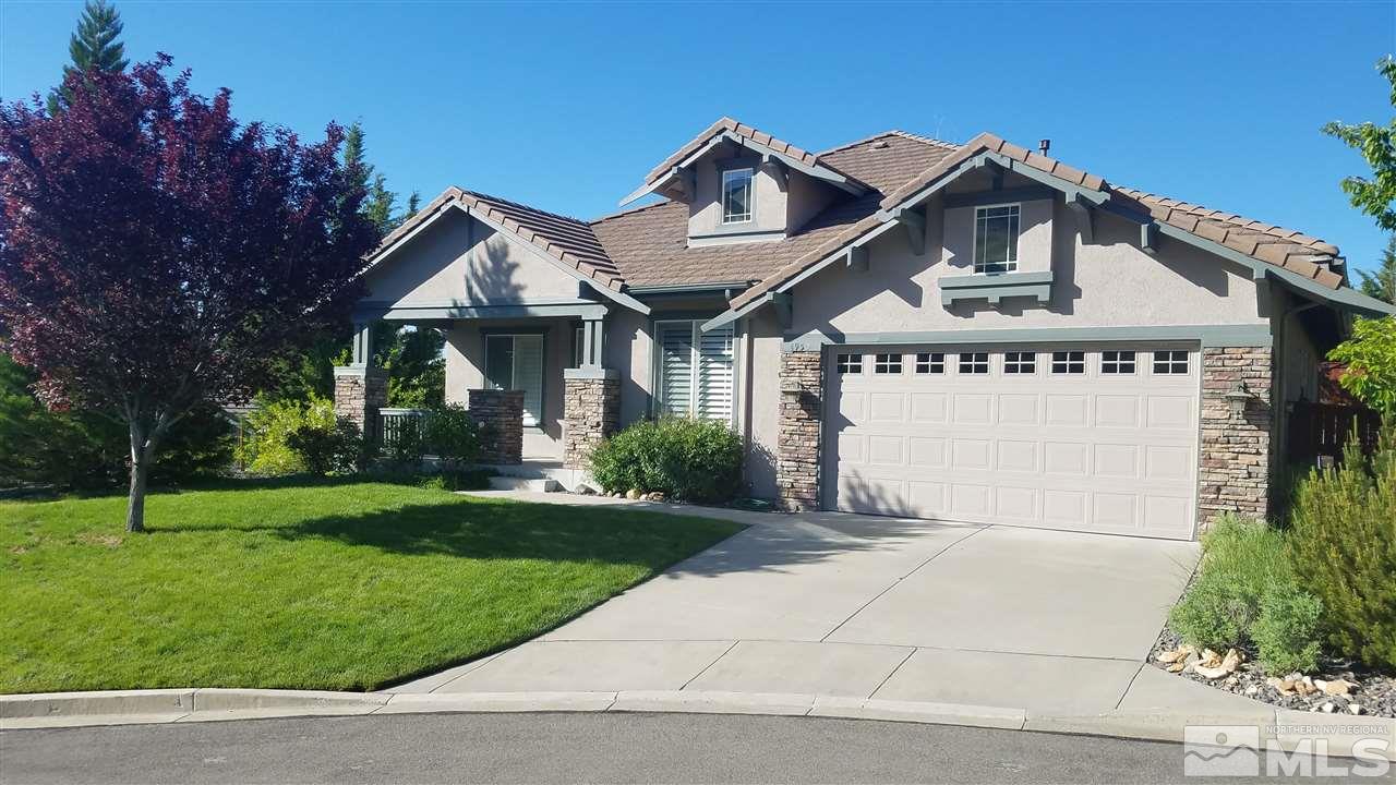 4950 Turning Leaf Way Reno, NV 89519 - Photo 1 of 11 a front view of a house with a yard