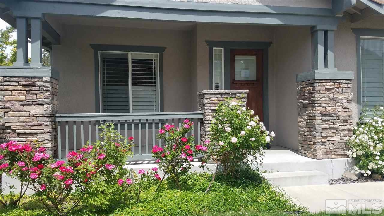 4950 Turning Leaf Way Reno, NV 89519 - Photo 2 of 11 a flower plants in front of a house