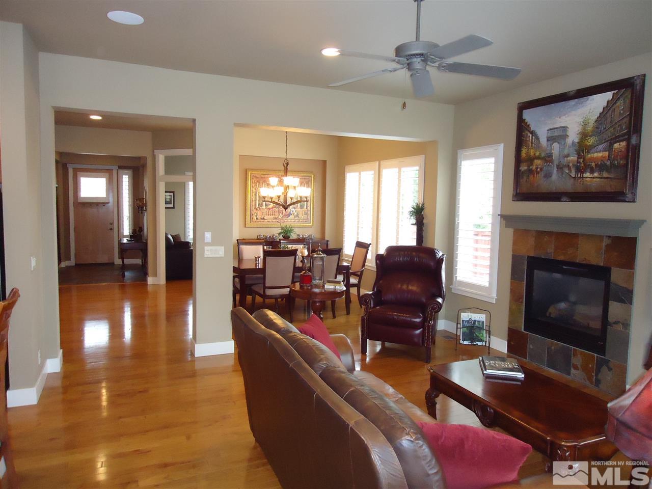 4950 Turning Leaf Way Reno, NV 89519 - Photo 6 of 11 a living room with furniture fireplace and a table