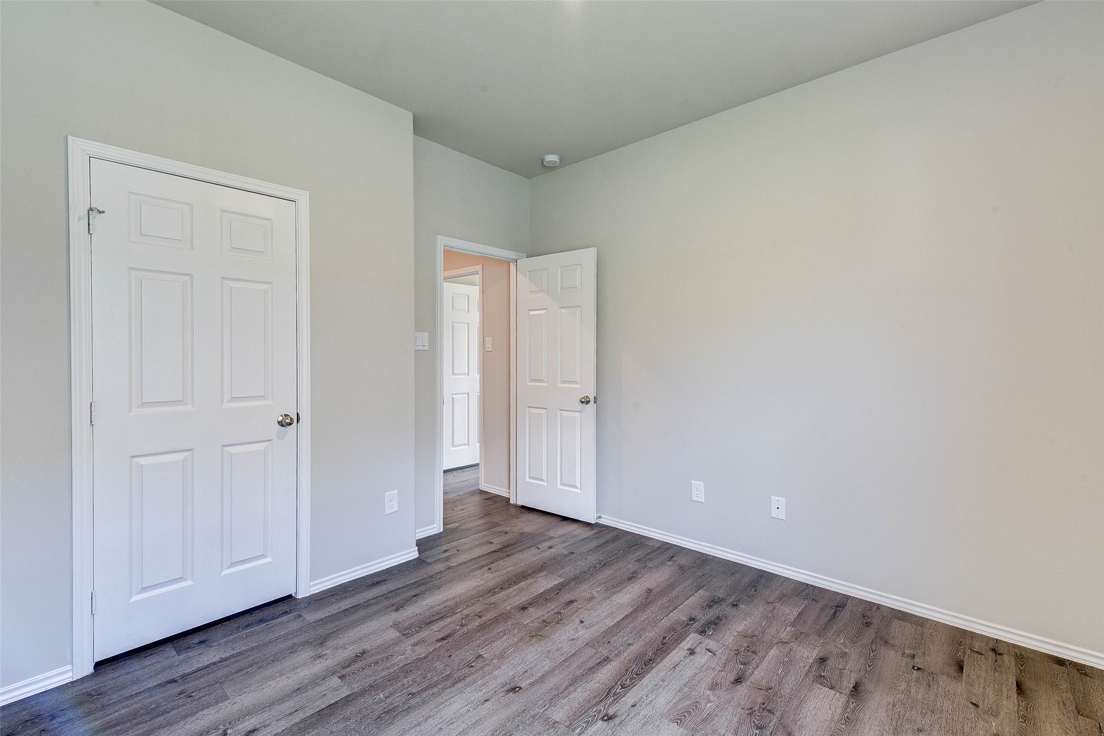 409 East Avenue G Conroe, TX 77301 - Photo 14 of 22 a view of an empty room and wooden floor