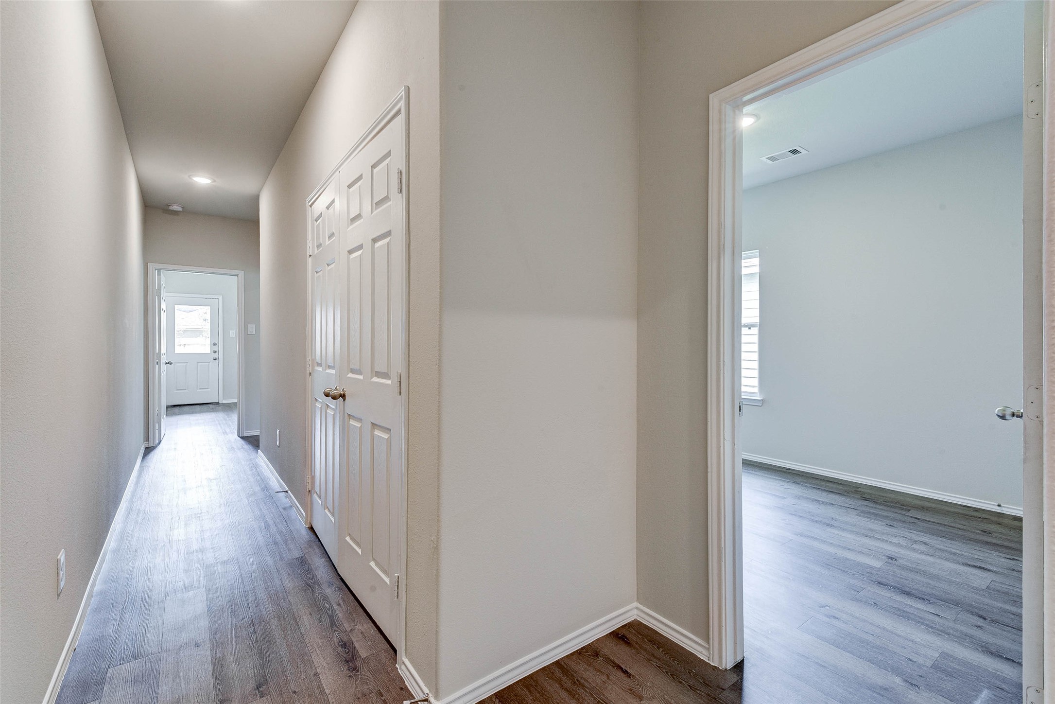 409 East Avenue G Conroe, TX 77301 - Photo 9 of 22 a view of a hallway with wooden floor