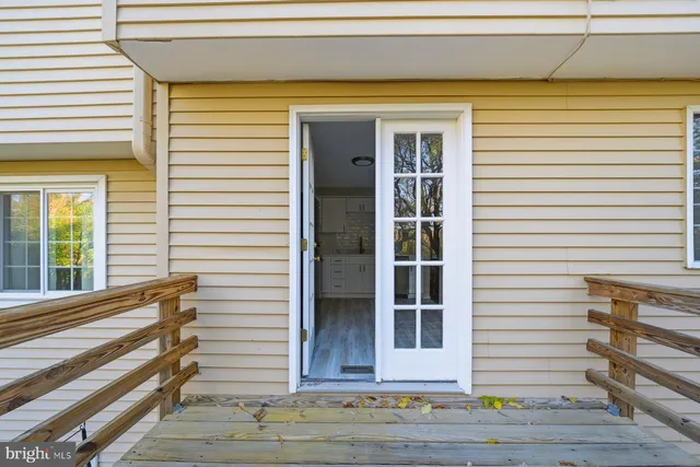 a view of a house with wooden deck