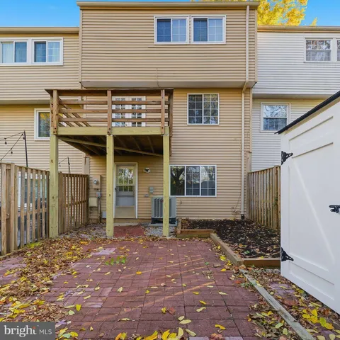a view of a livingroom with wooden floor and stairs