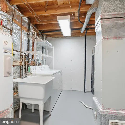 a picture of a bench in front of a wall