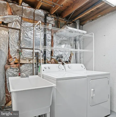 a picture of a bench in front of a wall