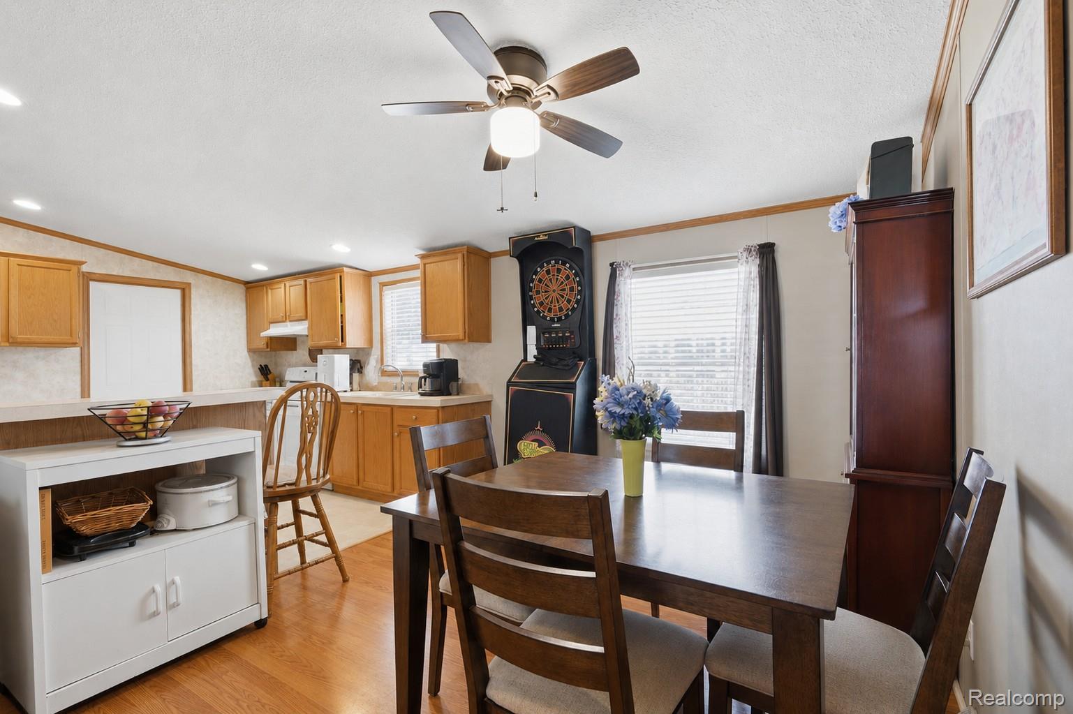 Open concept dining area with wood-finish flooring