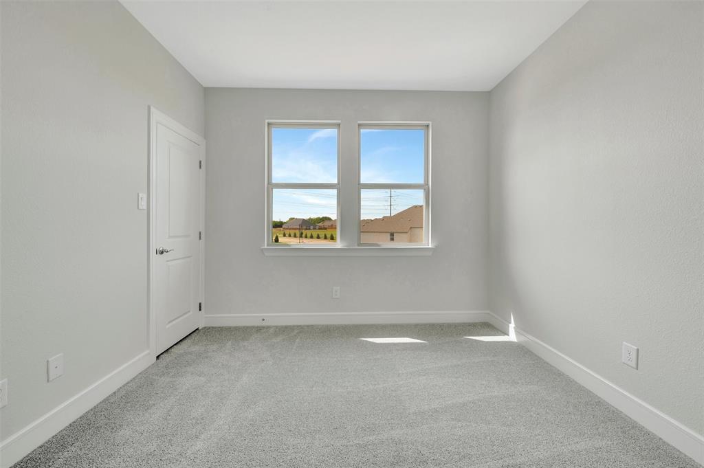 11460 Wulstone Road Fort Worth, TX 76052 - Photo 29 of 40 an empty room with a window