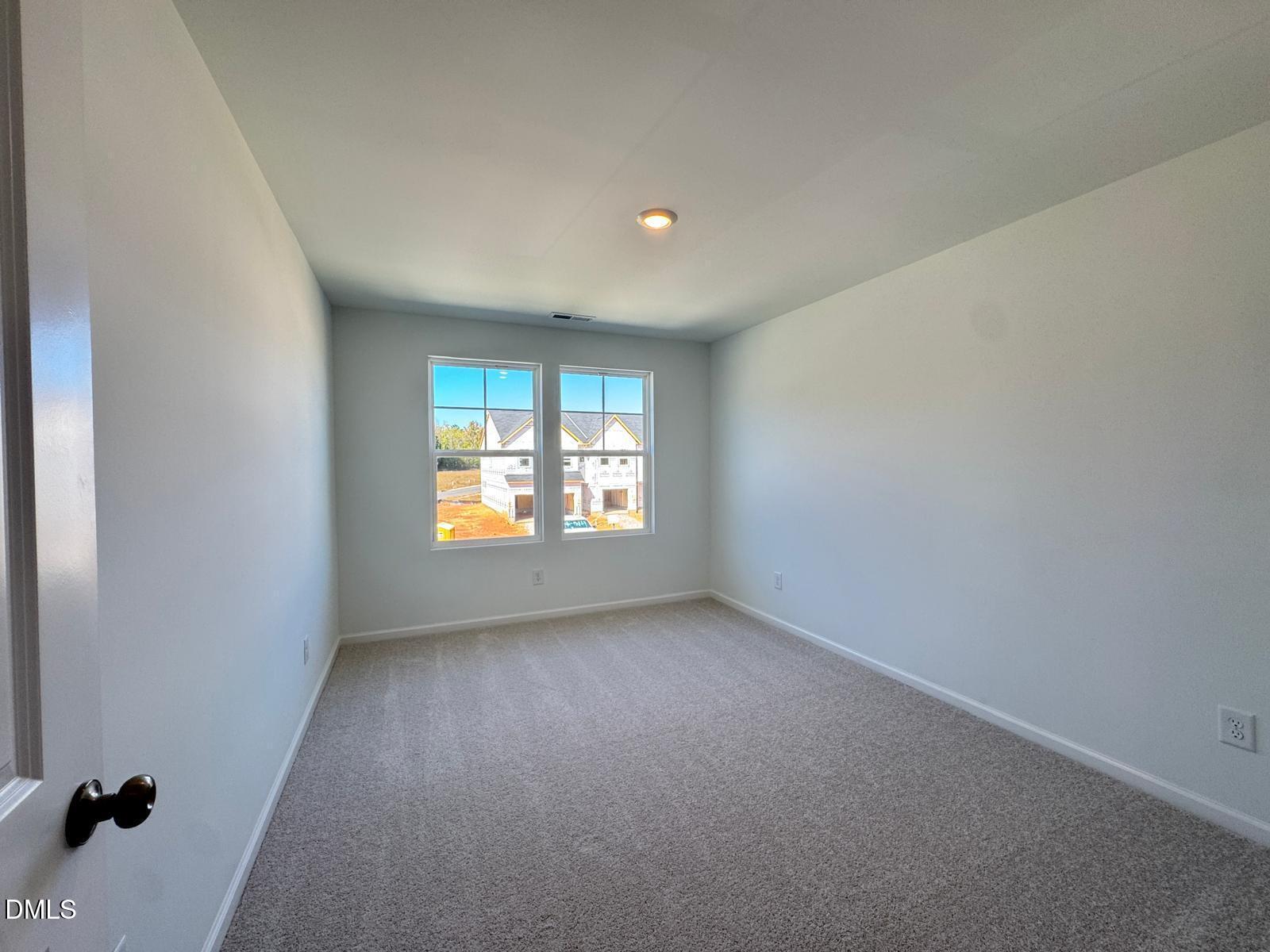 261 Lily Patch Lane Smithfield, NC 27577 - Photo 11 of 15 a view of an empty room with a window