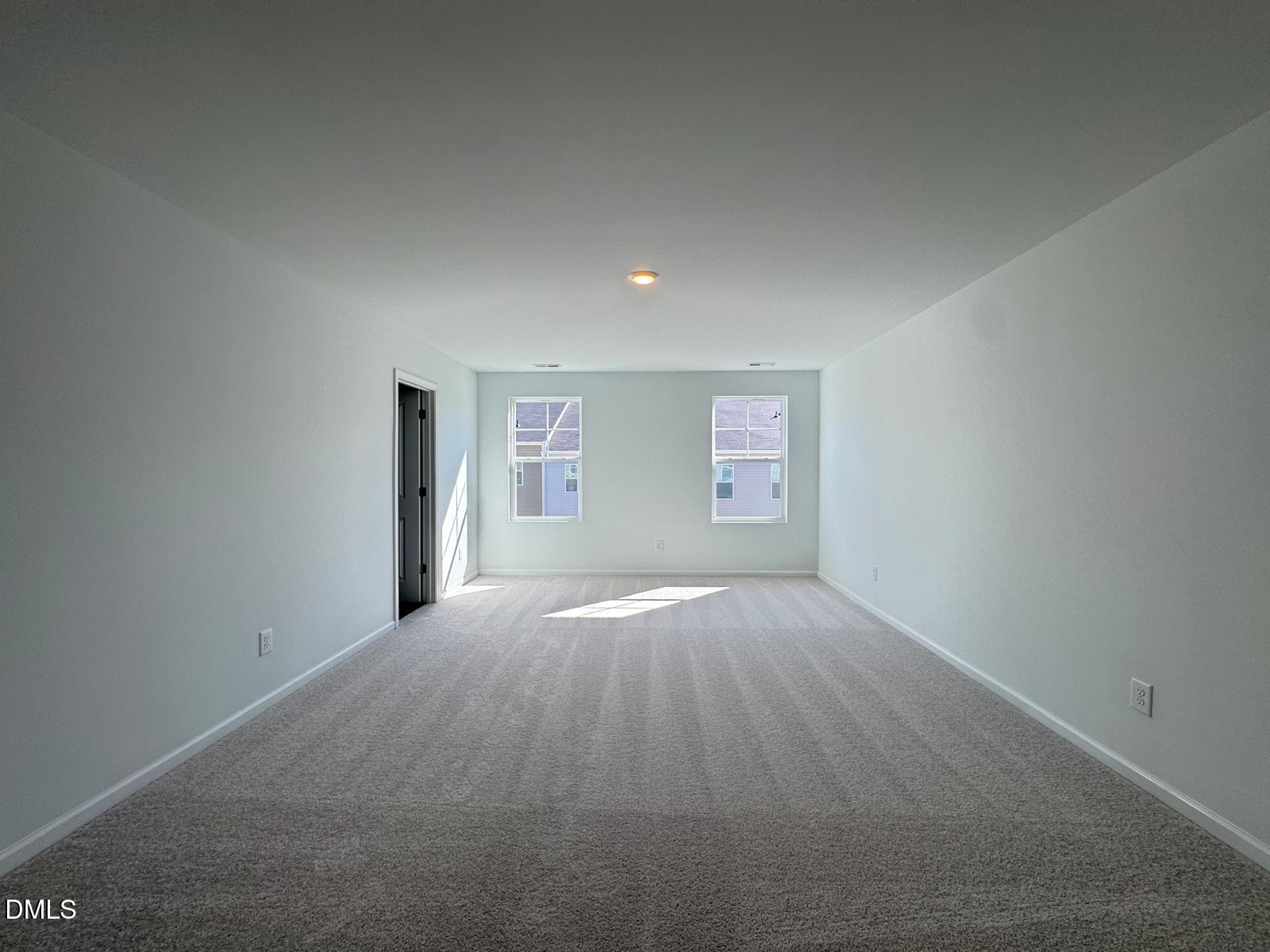 261 Lily Patch Lane Smithfield, NC 27577 - Photo 8 of 15 a view of empty room with windows