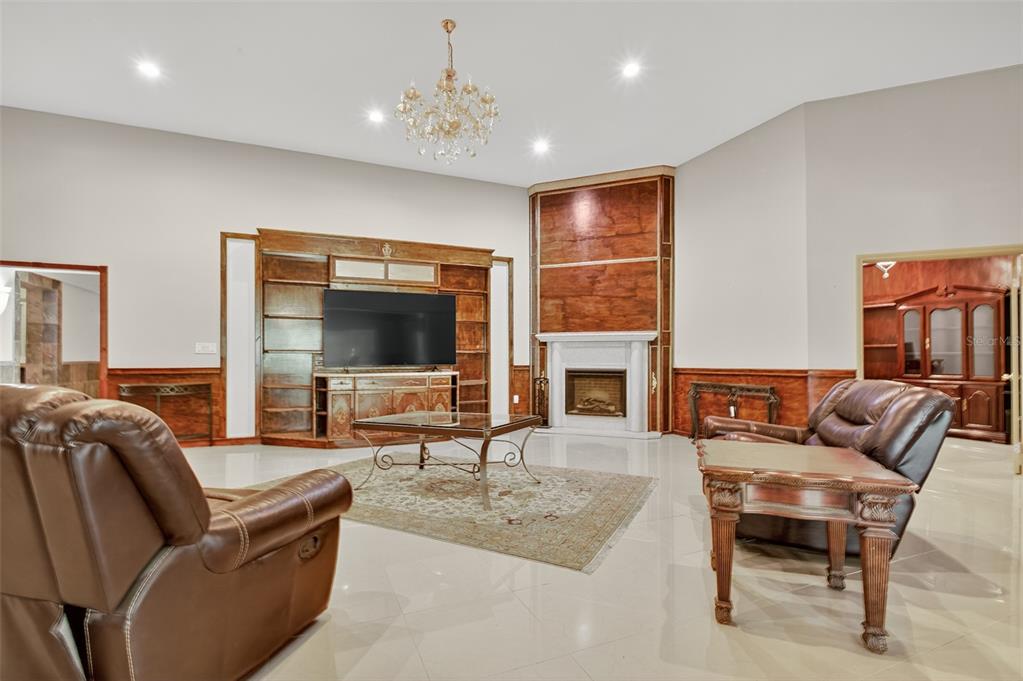 12903 112th Avenue Alachua, FL 32615 - Photo 20 of 95 a living room with furniture and a flat screen tv