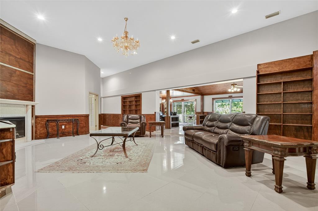 12903 112th Avenue Alachua, FL 32615 - Photo 23 of 95 a living room with furniture and a large window