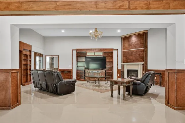 a bathroom with a granite countertop double vanity sink a mirror and a bathtub