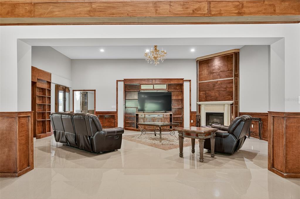 12903 112th Avenue Alachua, FL 32615 - Photo 24 of 95 a living room with furniture and a flat screen tv