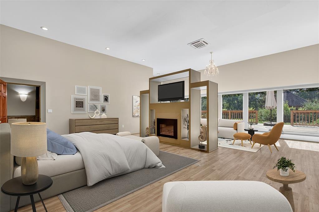 12903 112th Avenue Alachua, FL 32615 - Photo 25 of 95 a living room with furniture fireplace and flat screen tv