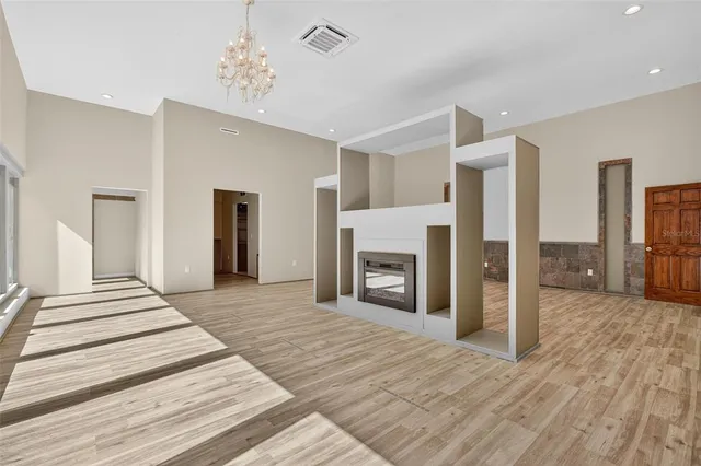 a bedroom with furniture and wooden floor