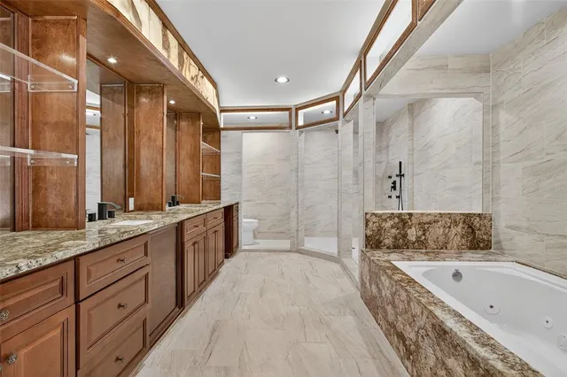 a bathroom with a bathtub and shower