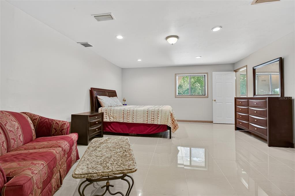 12903 112th Avenue Alachua, FL 32615 - Photo 40 of 95 a bedroom with furniture and wooden floor