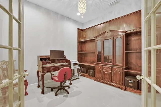 a view of a big house with a big yard and potted plants