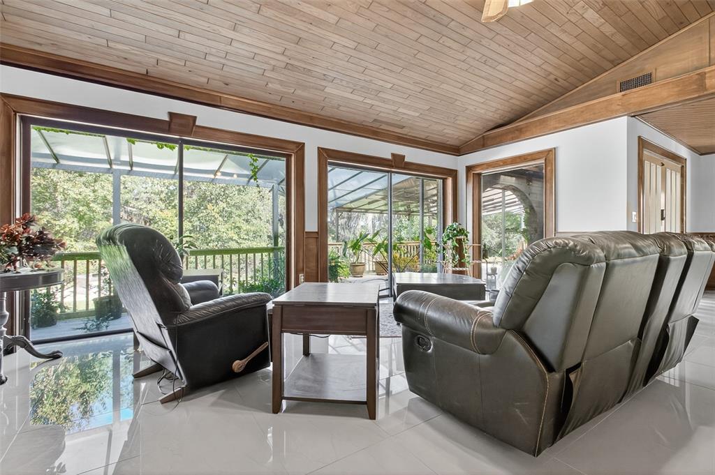 12903 112th Avenue Alachua, FL 32615 - Photo 6 of 95 a living room with furniture and a large window
