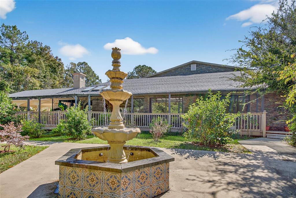 12903 112th Avenue Alachua, FL 32615 - Photo 66 of 95 a front view of a house with garden