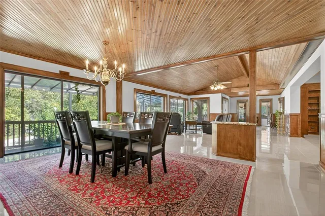 a kitchen with granite countertop white cabinets and white stainless steel appliances