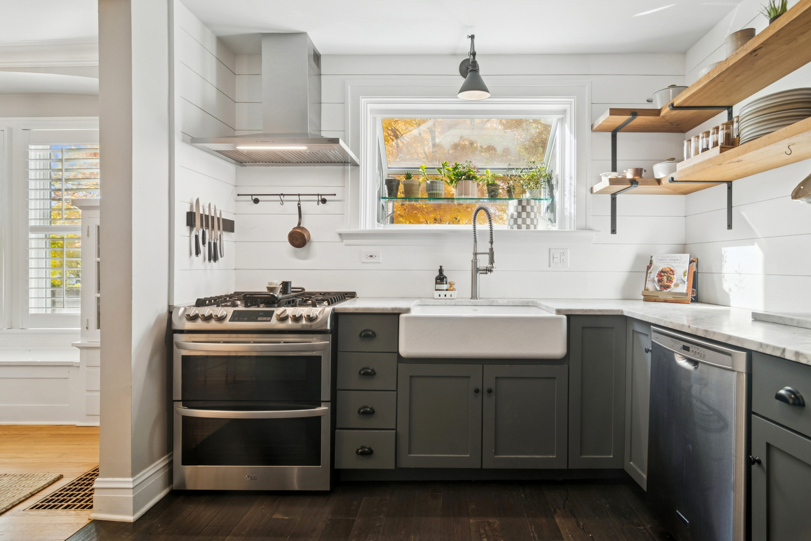 212 Washington Street Barrington, IL 60010 - Photo 13 of 55 a kitchen with stainless steel appliances a sink stove and cabinets