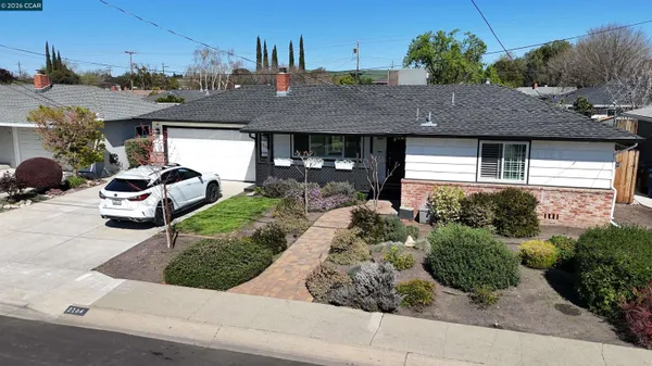 a view of a house with a street and garage