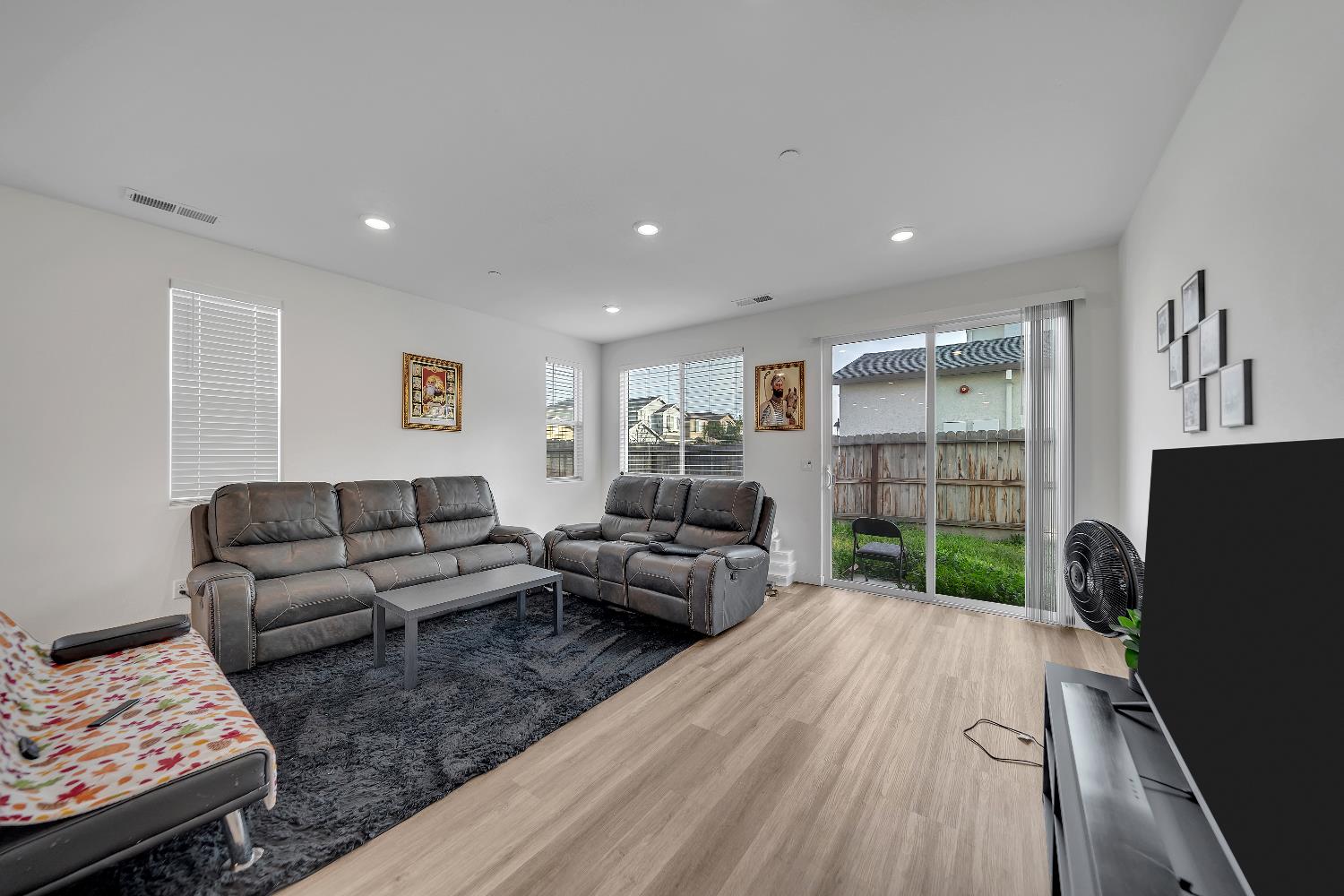 4806 Ariel Street Keyes, CA 95328 - Photo 11 of 42 a living room with furniture and a flat screen tv