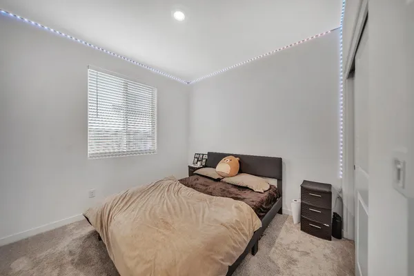 a large kitchen with stainless steel appliances lots of counter space and wooden floor