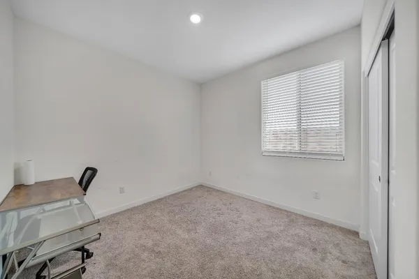 a kitchen with stainless steel appliances a sink stove and refrigerator
