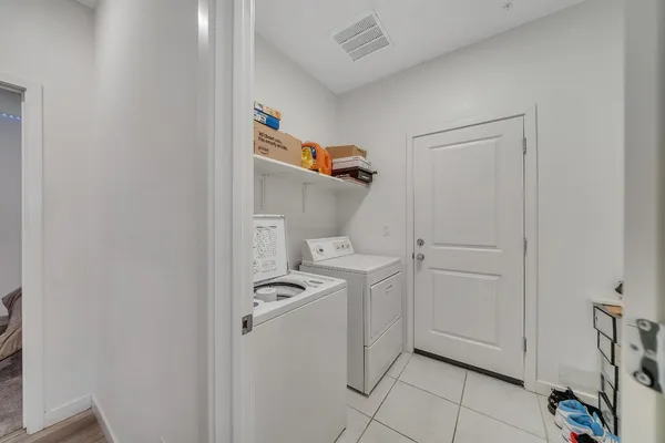 a kitchen with a sink stove top oven and microwave