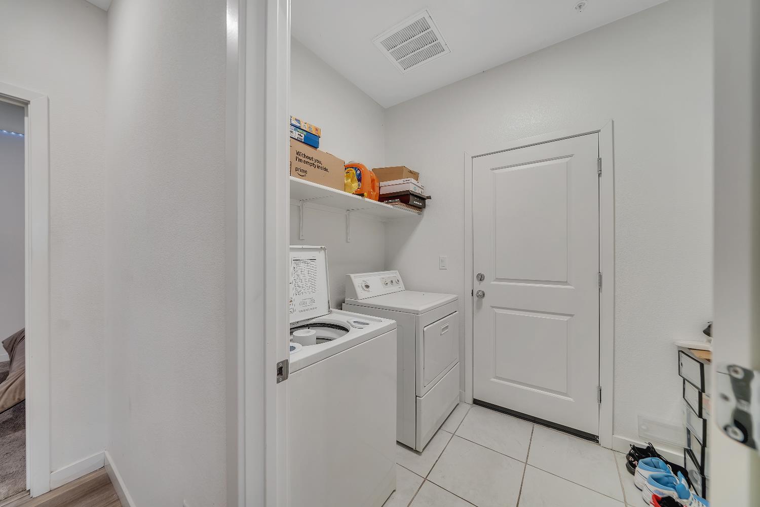 4806 Ariel Street Keyes, CA 95328 - Photo 20 of 42 a utility room with dryer and washer