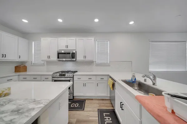 a bathroom with a double vanity sink and a mirror