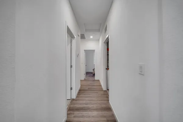 a bedroom with a bed and a television