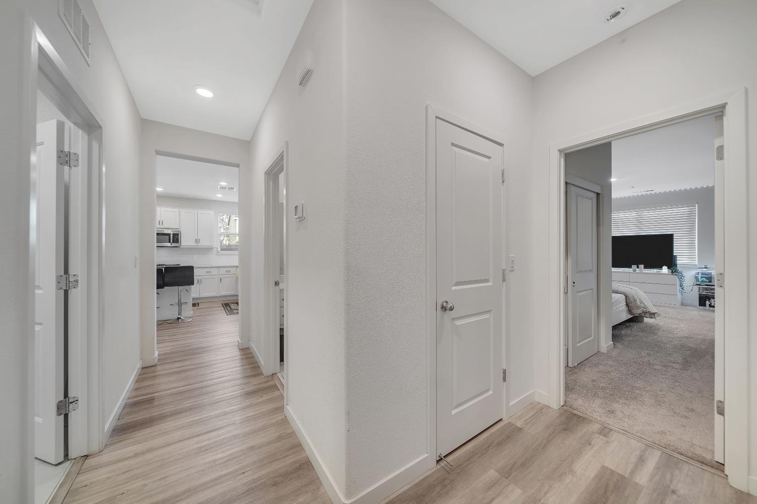 4806 Ariel Street Keyes, CA 95328 - Photo 31 of 42 a view of a hallway with a livingroom and a bedroom