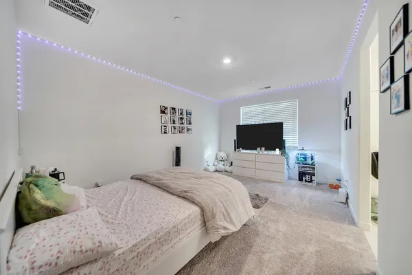 a large white kitchen with a large window