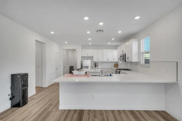 a view of a hallway with a white walls