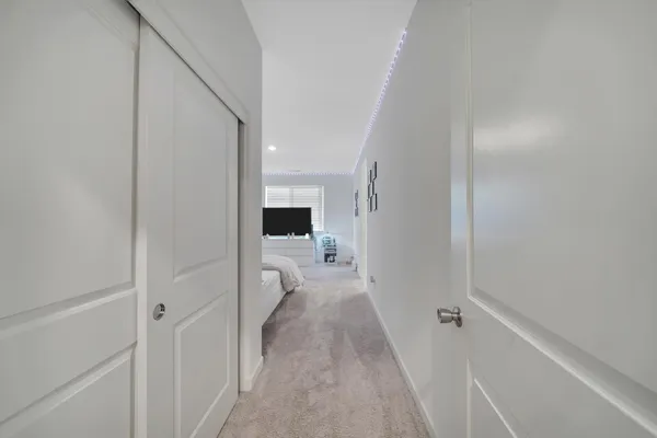 a house with green field in front of it