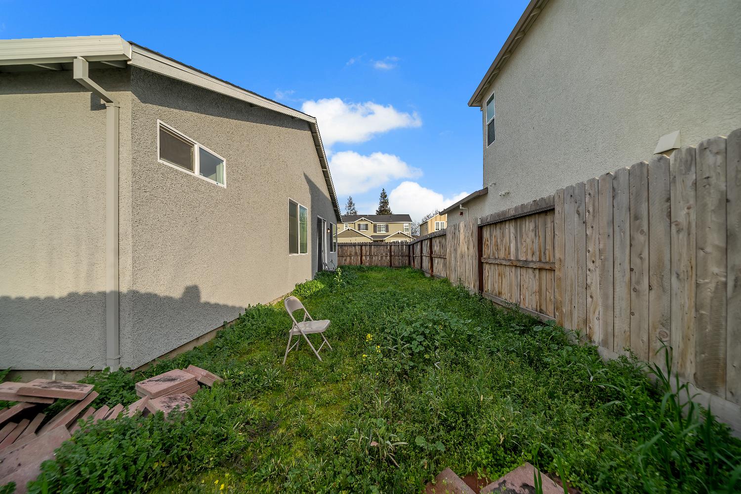 4806 Ariel Street Keyes, CA 95328 - Photo 37 of 42 a backyard of a house with lots of green space