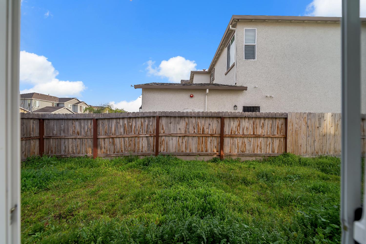 4806 Ariel Street Keyes, CA 95328 - Photo 40 of 42 a view of a backyard with a fence