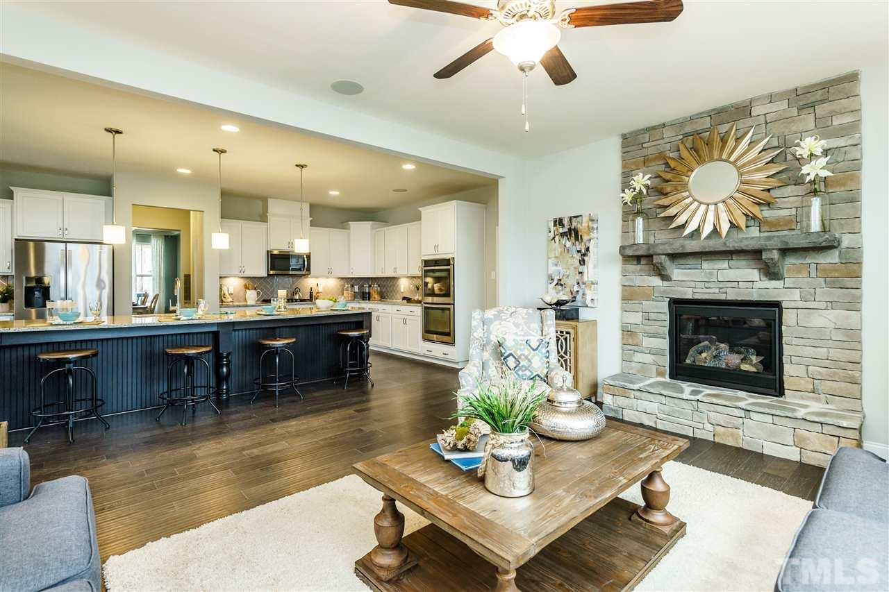 125 Twilight Trail, Unit STONEFIELD Willow Spring, NC 27592 - Photo 14 of 22 a living room with furniture and a fireplace