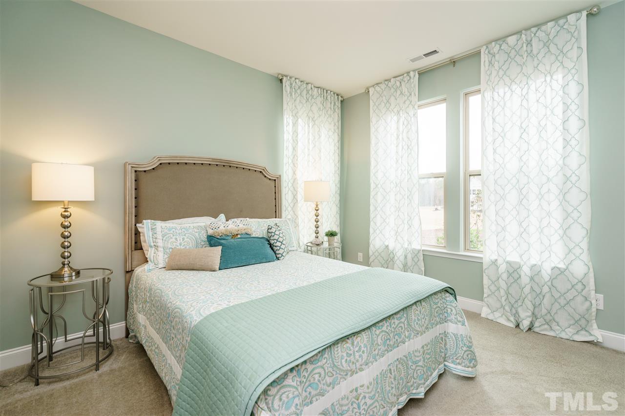 125 Twilight Trail, Unit STONEFIELD Willow Spring, NC 27592 - Photo 15 of 22 a bedroom with a bed and a window