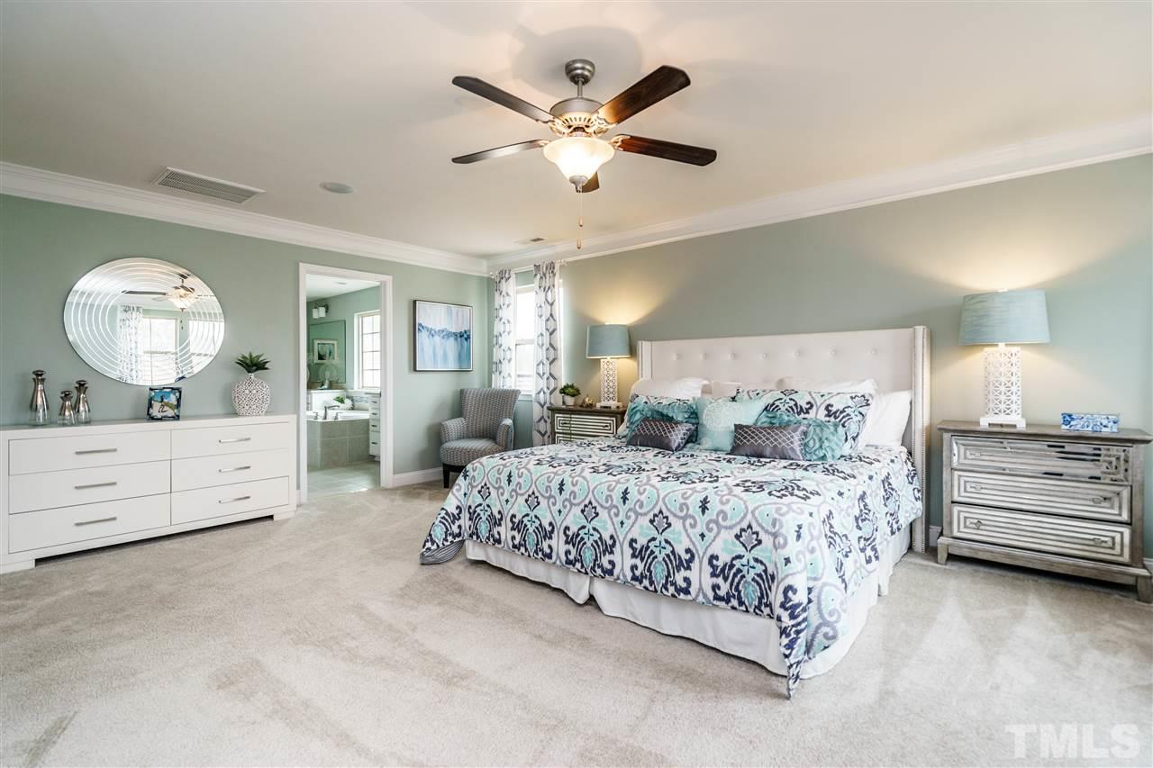 125 Twilight Trail, Unit STONEFIELD Willow Spring, NC 27592 - Photo 19 of 22 a bed room with bed and window