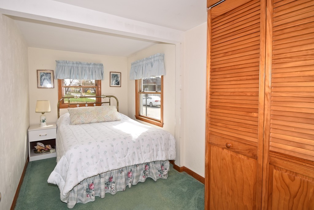 6 Beach Street Wareham, MA 02571 - Photo 12 of 19 a bedroom with a bed and a window
