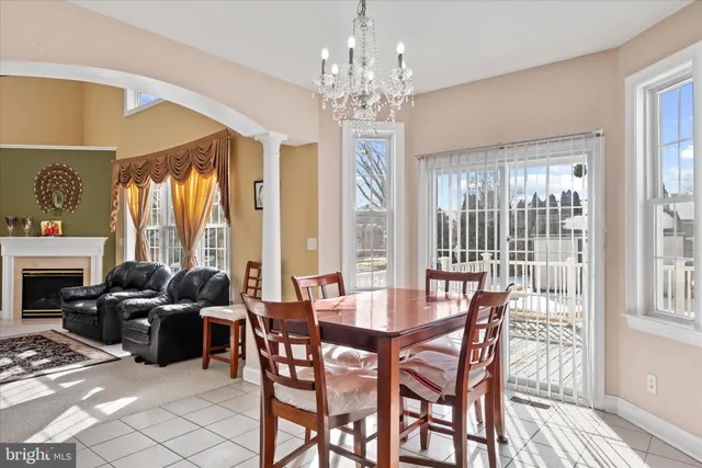 a dining room with furniture and window