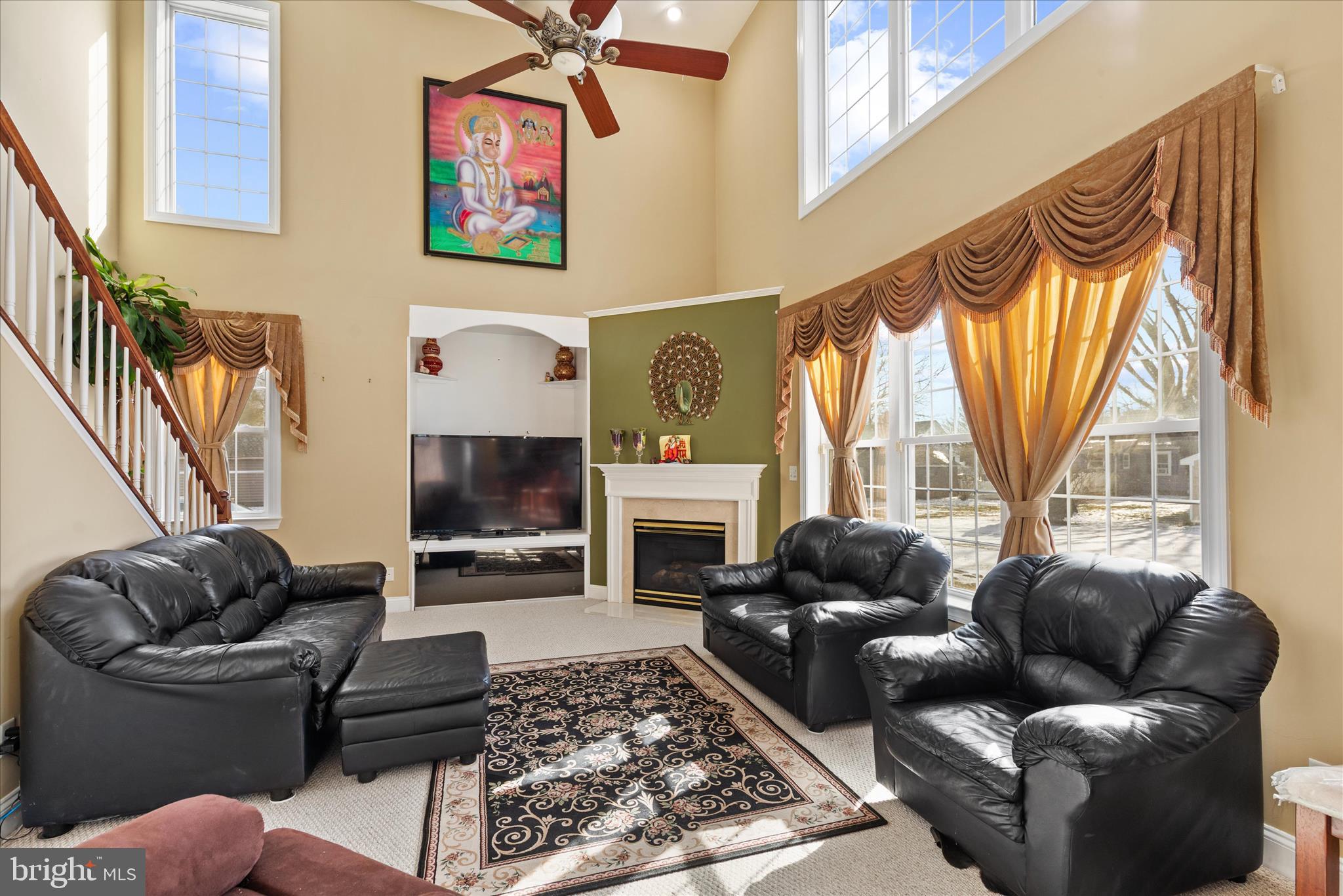 108 Franklin Avenue Berlin, MD 21811 - Photo 17 of 62 a living room with furniture a fireplace and a large window