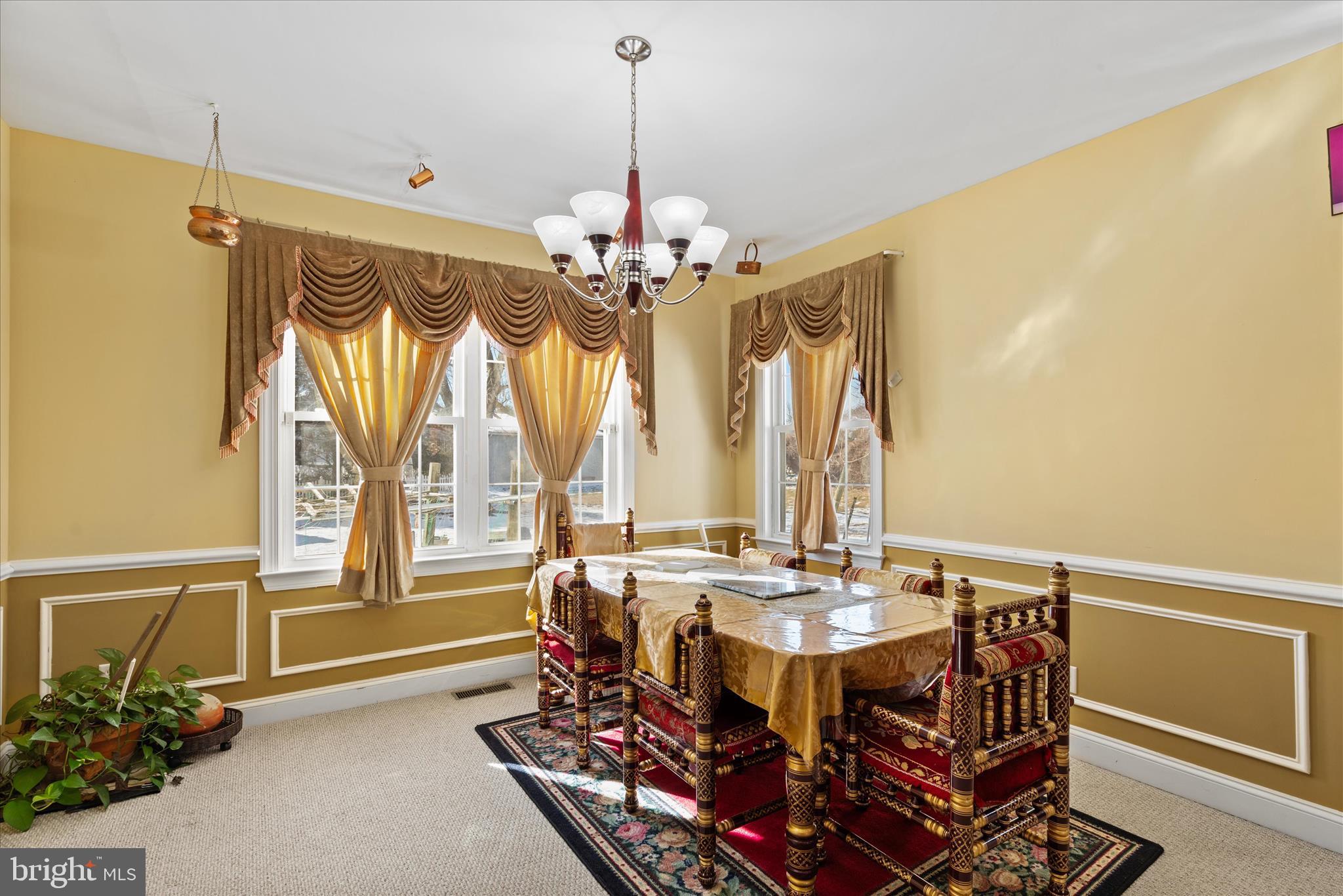 108 Franklin Avenue Berlin, MD 21811 - Photo 21 of 62 a view of a dining room with furniture window and outside view
