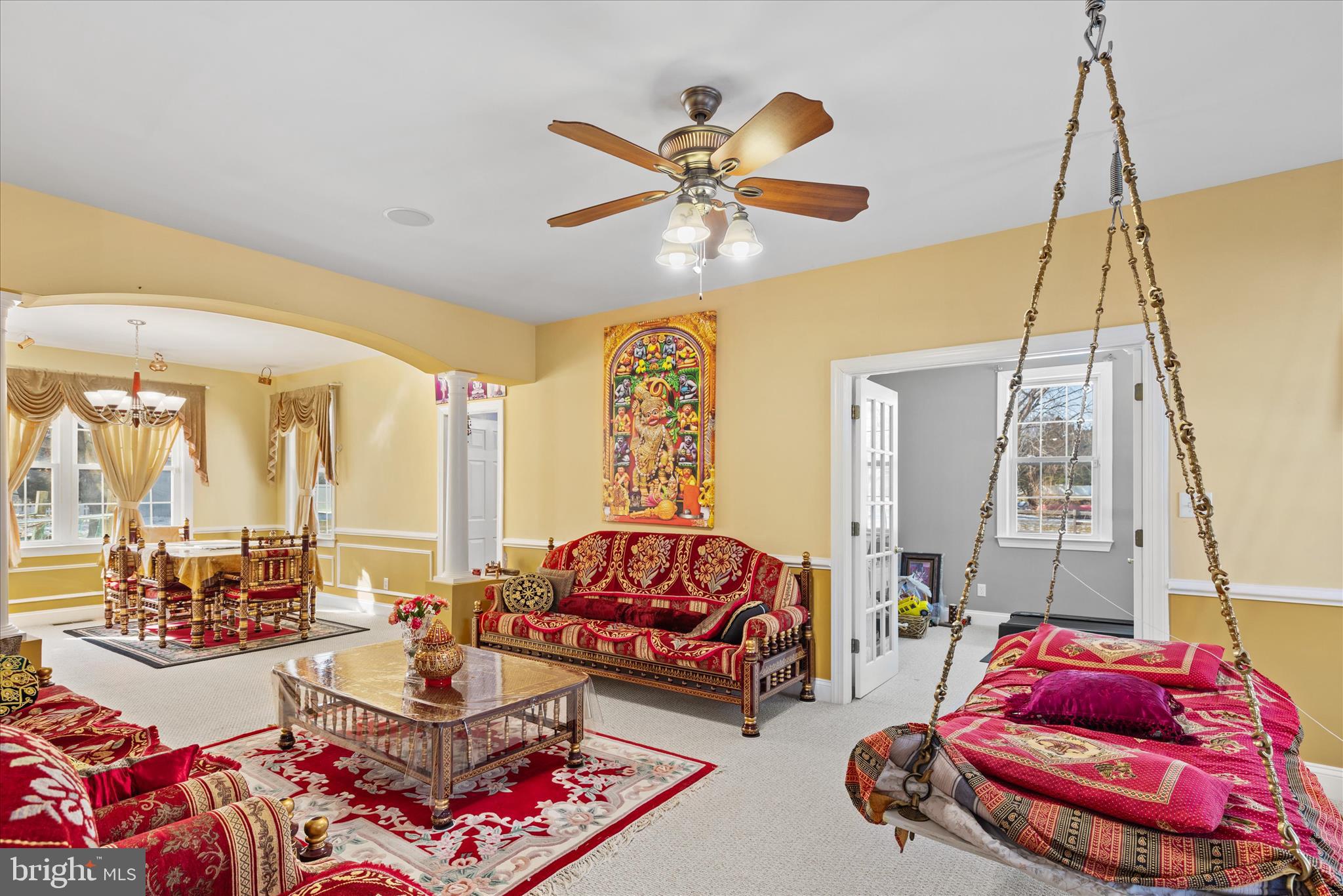 108 Franklin Avenue Berlin, MD 21811 - Photo 27 of 62 a living room with furniture and a chandelier
