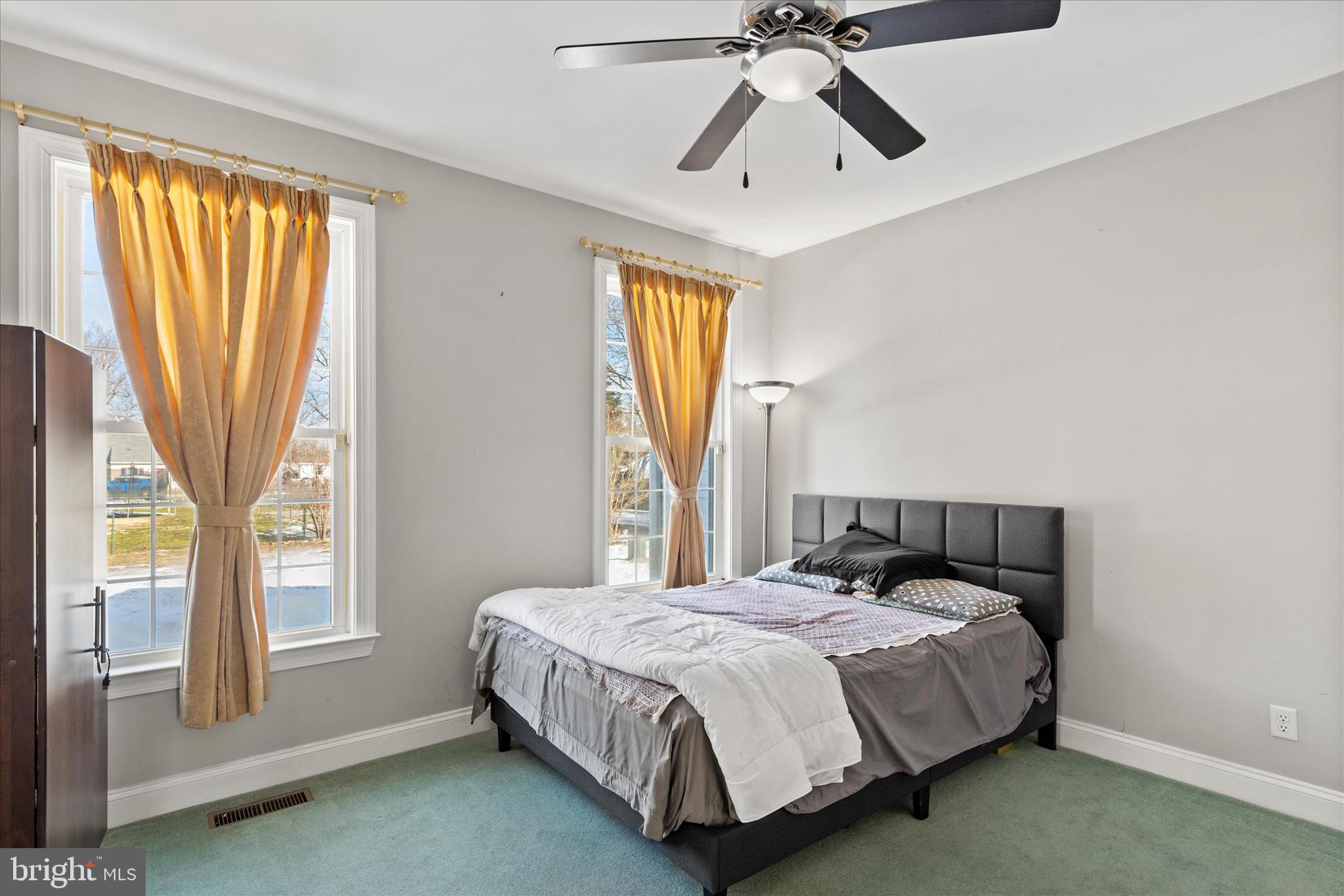 108 Franklin Avenue Berlin, MD 21811 - Photo 32 of 62 a bedroom with a bed and a chandelier